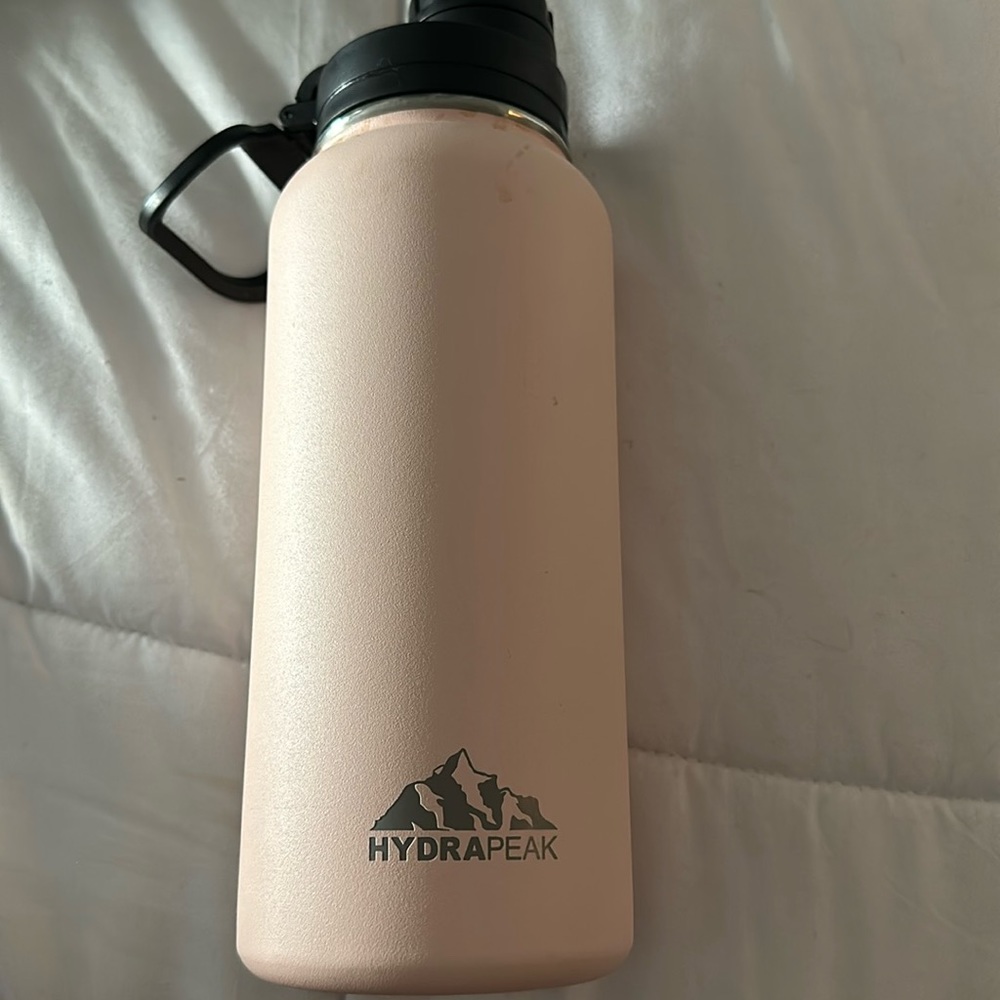 Pink HydraPeak water bottle.